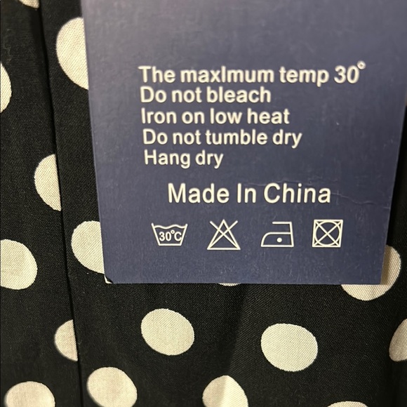 Black and White Sleeveless Maxi Dress with Ruffle Hem and V-Neckline - Picture 2 of 12